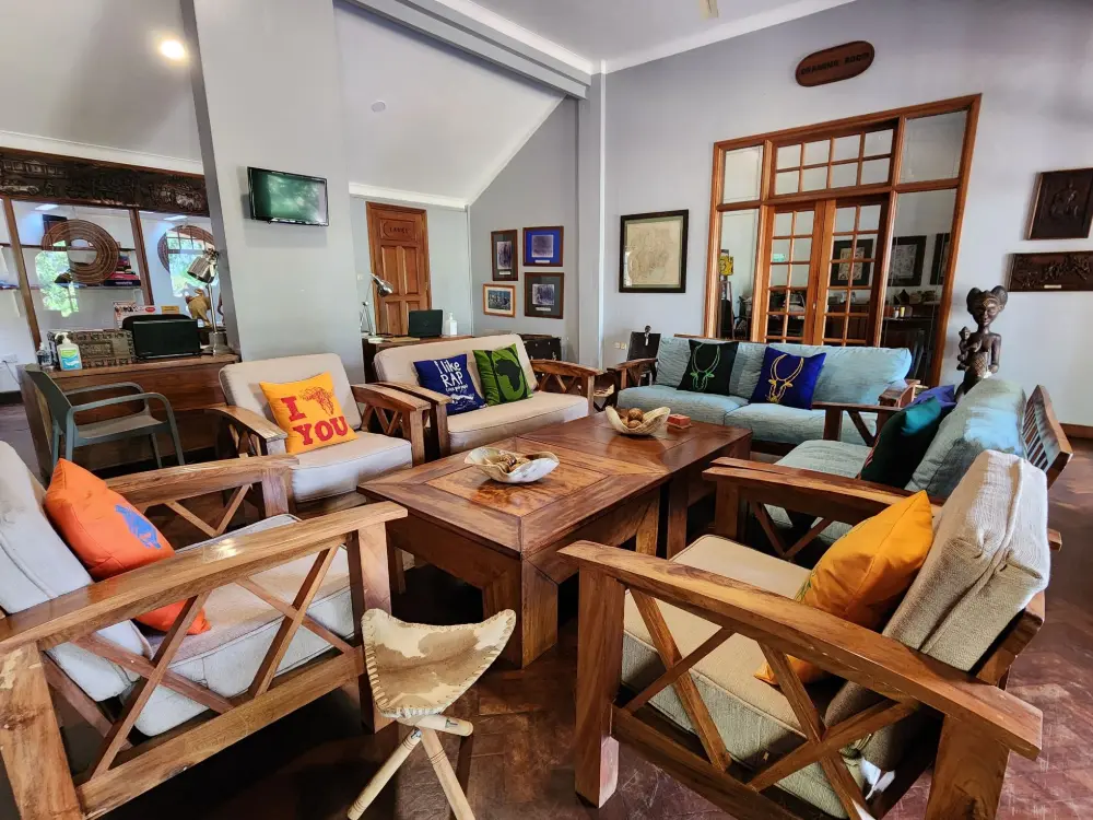 Cozy reception lounge with sofas and cushioned armchairs at Masindi Hotel
