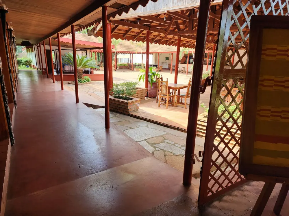 Covered walkway with a decorative lattice screen overlooking the courtyard at Masindi Hotel