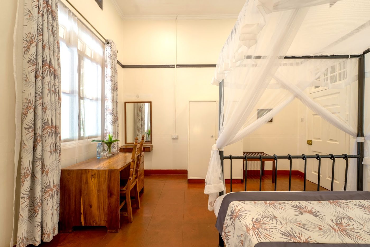A room at Masindi Hotel with a writing desk