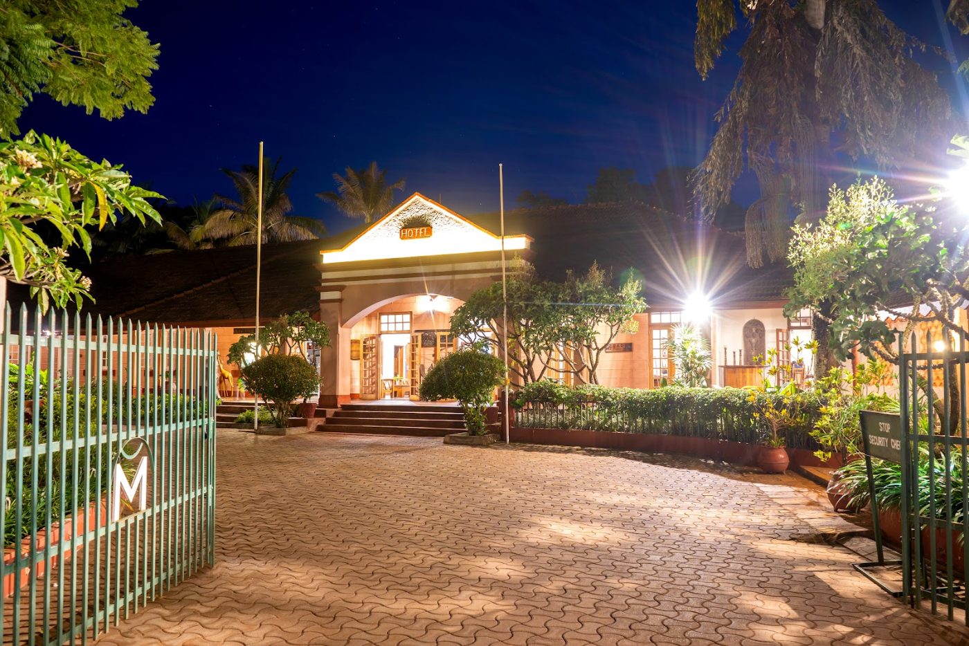 The entrance of Masindi Hotel lit at night