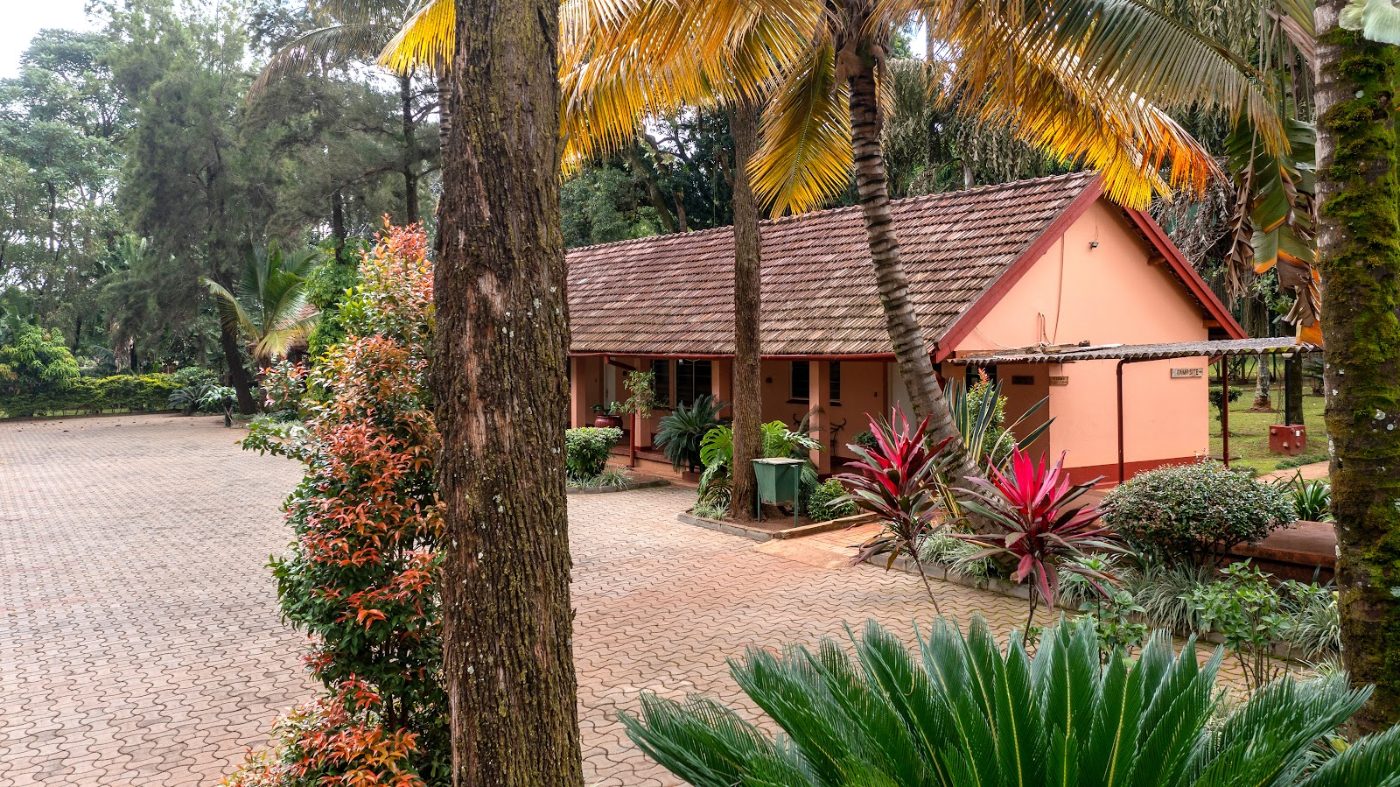 A room block and the gardens at Masindi Hotel