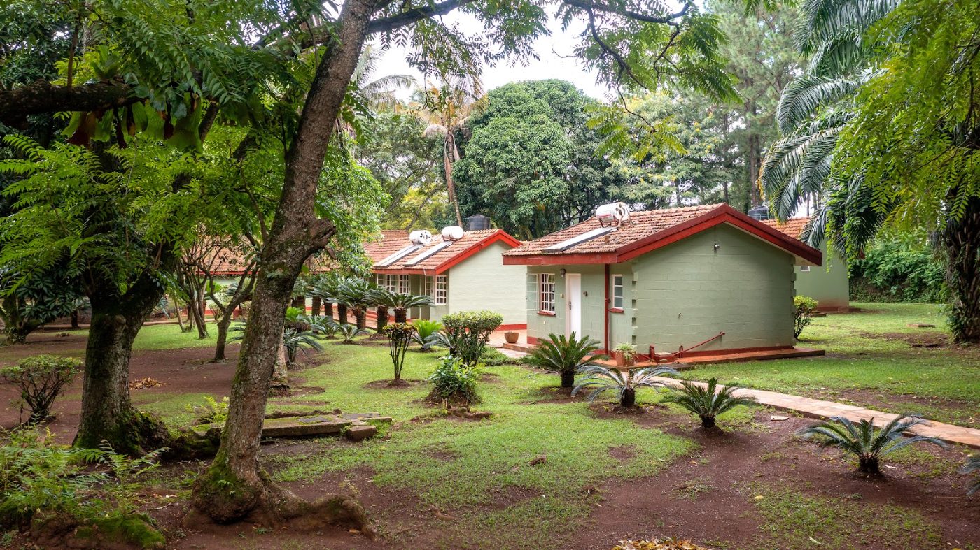 The room blocks and the lawn at Masindi Hotel