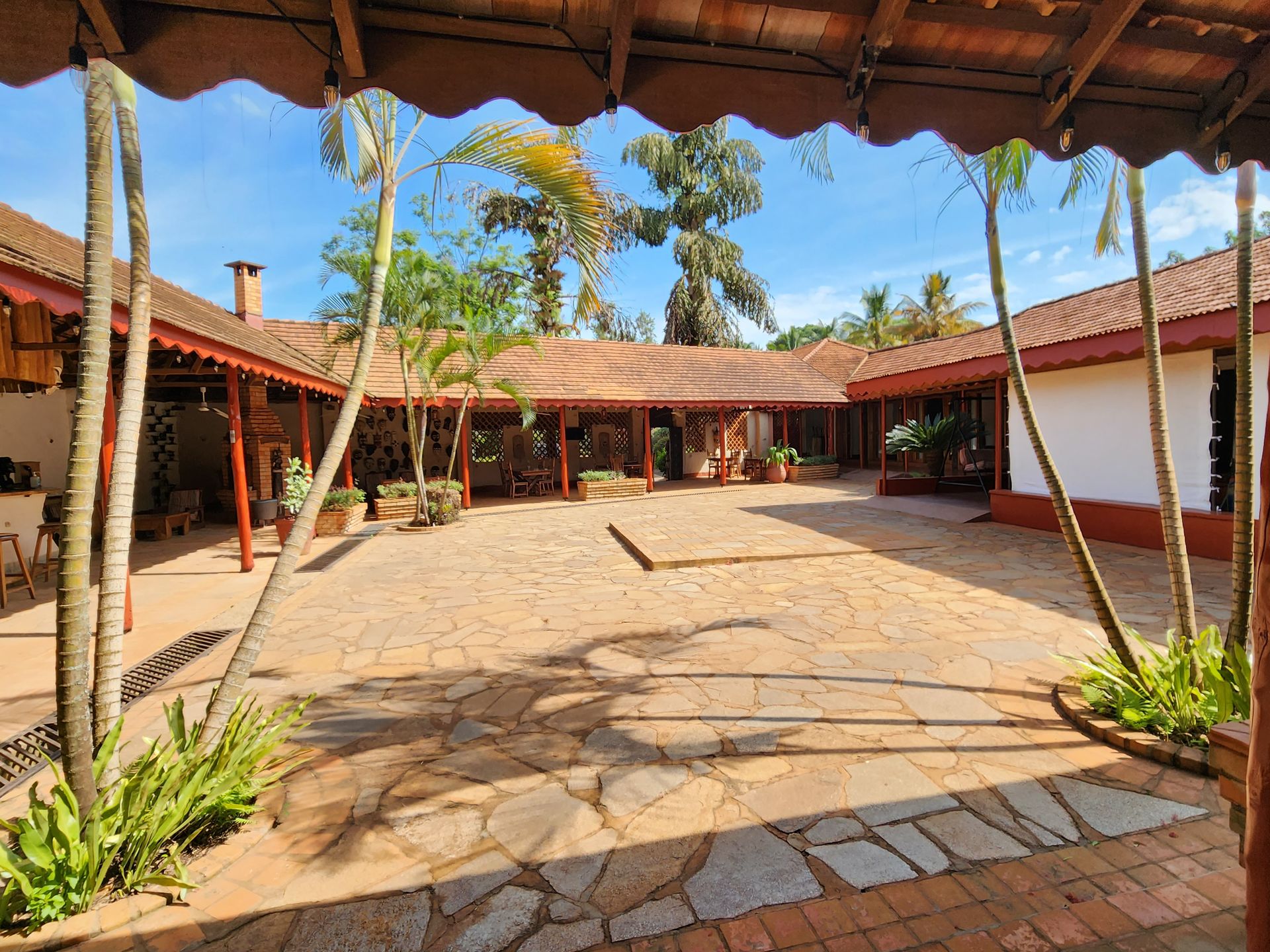 The courtyard at Masindi Hotel, open to the sky and ringed by palms