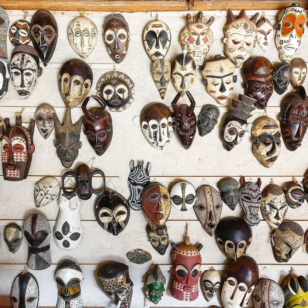 The wall of African masks at Masindi Hotel