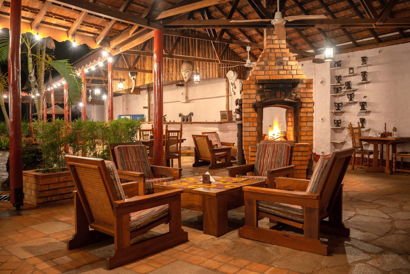 The fire lit at dusk in the courtyard at Masindi Hotel