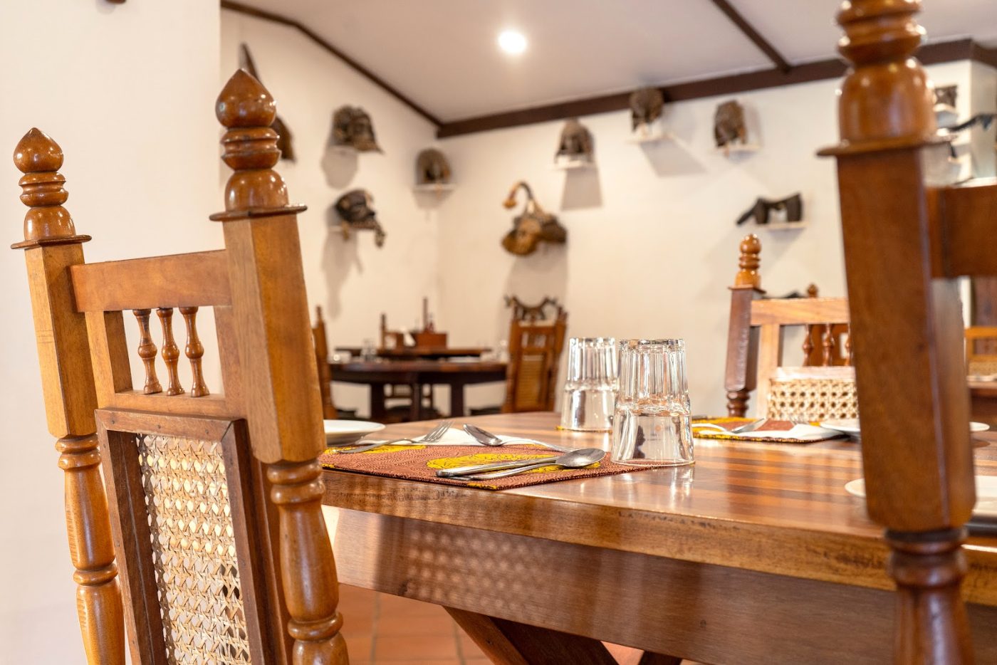 Carved chairs and long tables at Masindi Hotel
